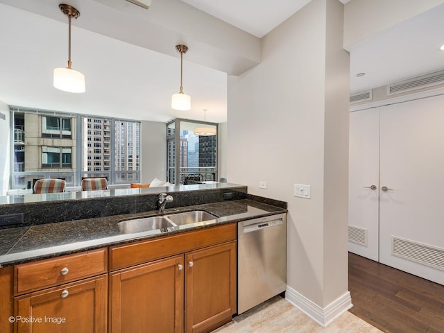 600 N Lake Shore Dr Unit 1802, Chicago, IL 60611 - kitchen with a sink, brown cabinetry, stainless steel dishwasher, visible vents, and pendant lighting