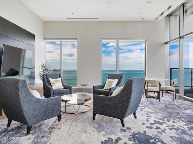 600 N Lake Shore Dr Unit 1802, Chicago, IL 60611 - living area with visible vents, a water view, and a wealth of natural light