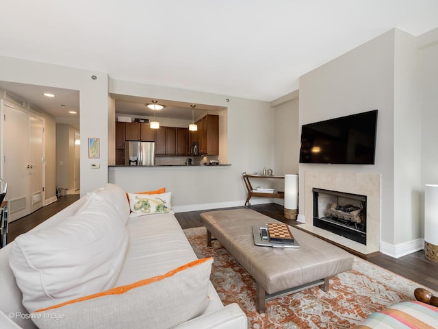 600 N Lake Shore Dr Unit 1802, Chicago, IL 60611 - living area featuring a fireplace with flush hearth, visible vents, dark wood-style floors, and baseboards