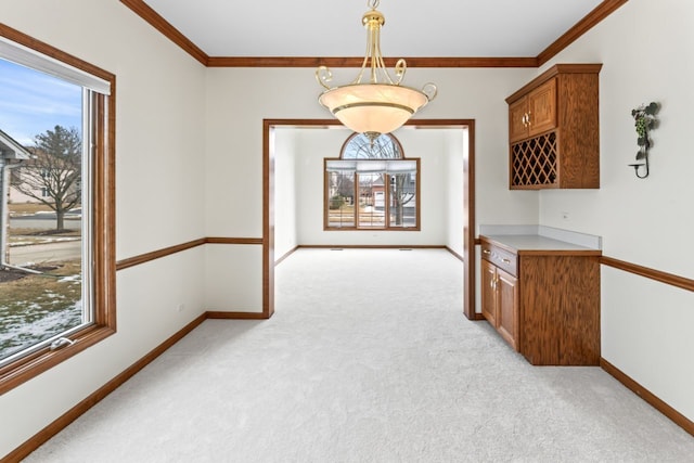 interior space with light colored carpet and plenty of natural light