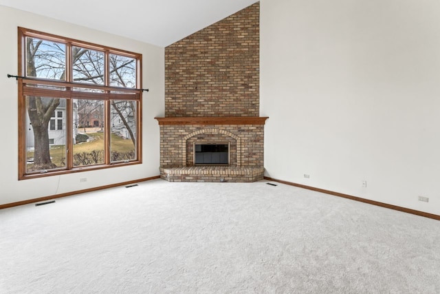 unfurnished living room featuring visible vents, baseboards, carpet flooring, and high vaulted ceiling