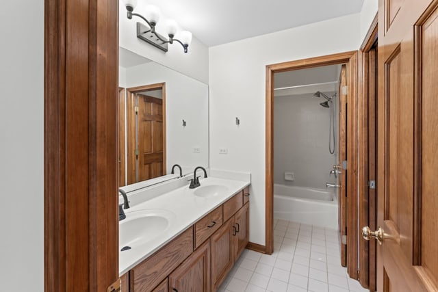 bathroom featuring shower / tub combination, tile patterned flooring, a sink, and double vanity