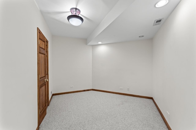carpeted empty room featuring baseboards, visible vents, and recessed lighting