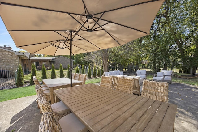2104 Oakwood Ave, Bloomington, IL 61704 - wooden deck featuring outdoor lounge area, outdoor dining area, a patio, and fence