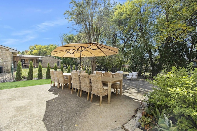 2104 Oakwood Ave, Bloomington, IL 61704 - view of patio / terrace with fence and outdoor dining area
