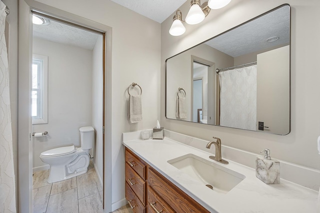 2104 Oakwood Ave, Bloomington, IL 61704 - full bath featuring toilet, a textured ceiling, and vanity
