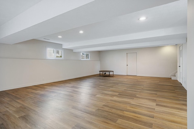 2104 Oakwood Ave, Bloomington, IL 61704 - below grade area featuring baseboards, stairway, wood finished floors, and recessed lighting