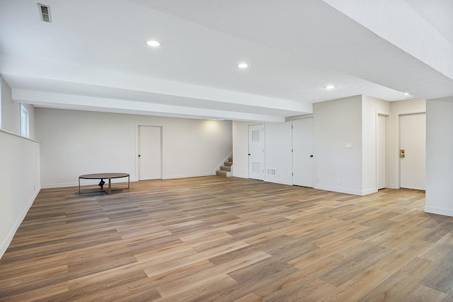 2104 Oakwood Ave, Bloomington, IL 61704 - hallway with a textured ceiling, visible vents, baseboards, and light carpet