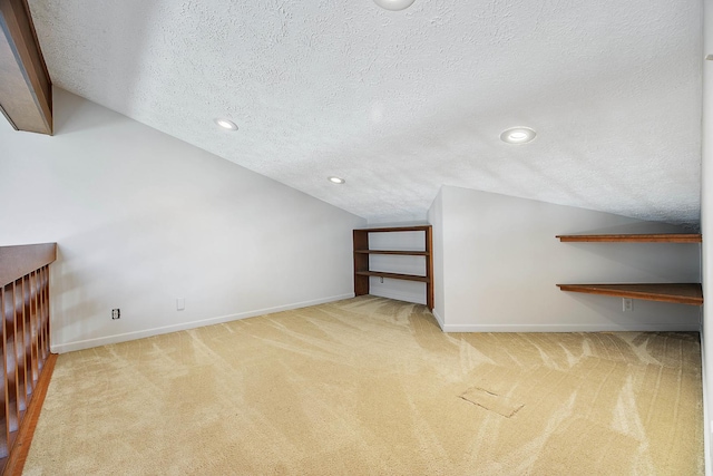 2104 Oakwood Ave, Bloomington, IL 61704 - bonus room featuring a textured ceiling, vaulted ceiling, and carpet floors