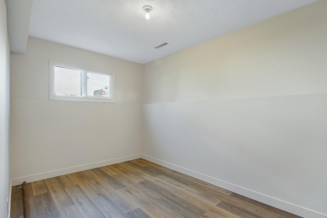 2104 Oakwood Ave, Bloomington, IL 61704 - unfurnished dining area with baseboards, visible vents, light wood finished floors, and recessed lighting
