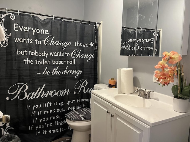 2809 Gilead Ave, Zion, IL 60099 - full bathroom featuring vanity, toilet, and a shower with curtain