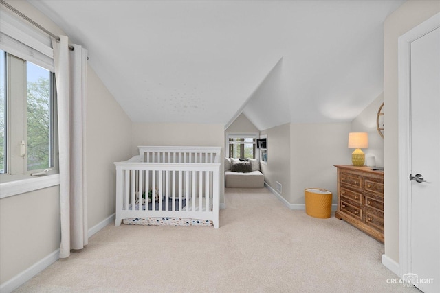 bedroom with baseboards, carpet, and vaulted ceiling