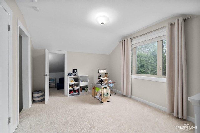 rec room featuring carpet flooring, baseboards, and lofted ceiling