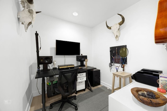 office space with baseboards