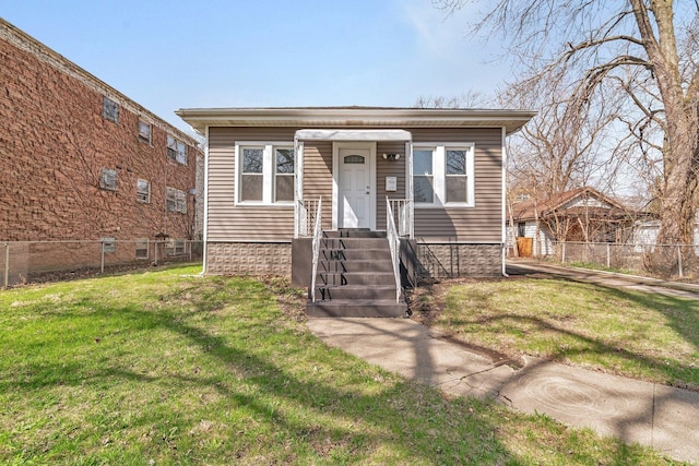 13916 S Dearborn St, Riverdale, IL 60827 - bungalow-style home with a front lawn and fence
