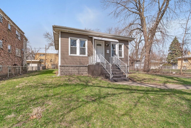 13916 S Dearborn St, Riverdale, IL 60827 - bungalow-style house with a front lawn and fence
