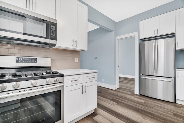 13916 S Dearborn St, Riverdale, IL 60827 - kitchen with light countertops, appliances with stainless steel finishes, white cabinetry, backsplash, and dark wood-style flooring