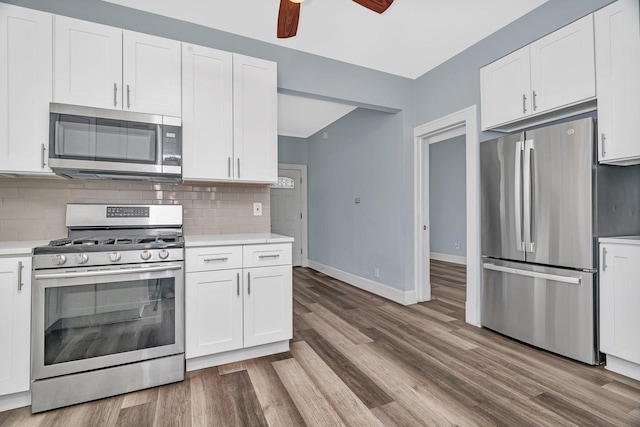 13916 S Dearborn St, Riverdale, IL 60827 - kitchen with light countertops, wood finished floors, appliances with stainless steel finishes, and a ceiling fan