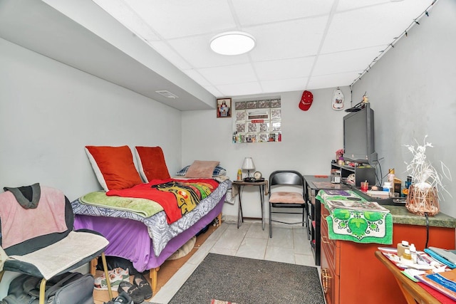 13916 S Dearborn St, Riverdale, IL 60827 - bedroom with light tile patterned flooring, visible vents, and a drop ceiling