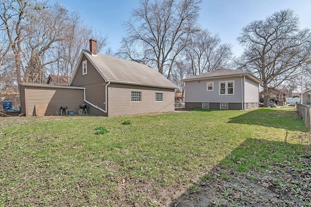 13916 S Dearborn St, Riverdale, IL 60827 - rear view of house featuring fence, a chimney, and a yard