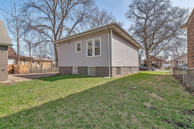13916 S Dearborn St, Riverdale, IL 60827 - view of home's exterior with a lawn and fence