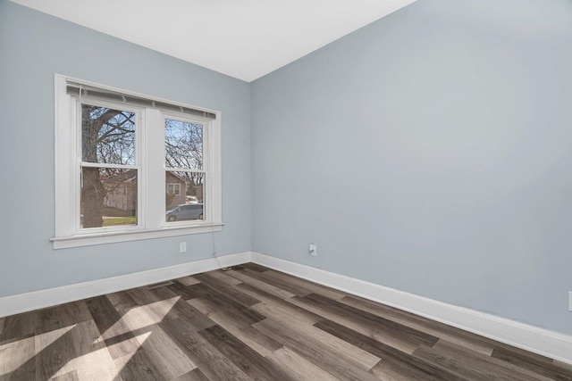 13916 S Dearborn St, Riverdale, IL 60827 - unfurnished room featuring baseboards and dark wood-style floors