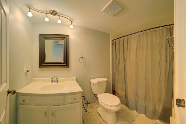 bathroom with tile patterned floors, a shower with curtain, toilet, visible vents, and vanity