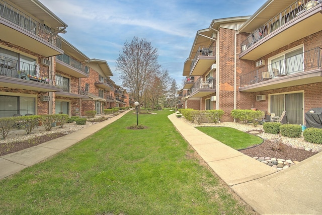 surrounding community featuring a residential view and a lawn