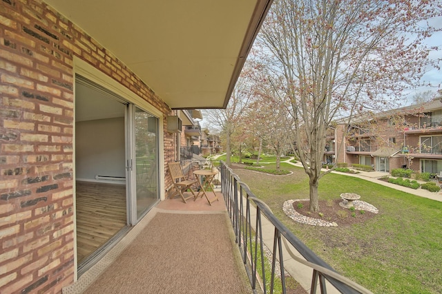 balcony featuring a baseboard heating unit