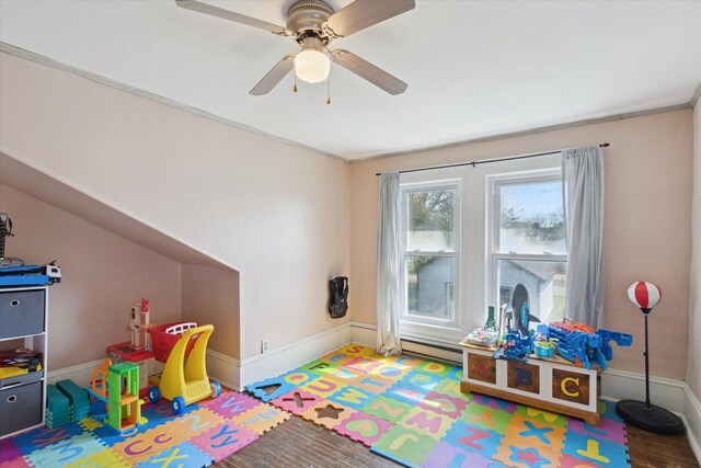 204 S Jackson Ave, Polo, IL 61064 - rec room featuring a ceiling fan, baseboard heating, and baseboards