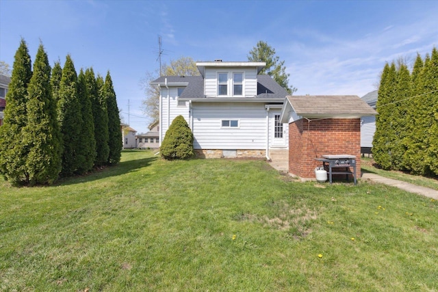 204 S Jackson Ave, Polo, IL 61064 - rear view of property with a lawn and roof with shingles