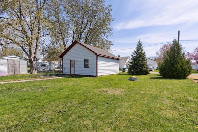 204 S Jackson Ave, Polo, IL 61064 - view of yard featuring an outbuilding, a shed, and fence