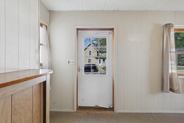 204 S Jackson Ave, Polo, IL 61064 - doorway to outside featuring wood walls and a healthy amount of sunlight