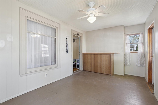 204 S Jackson Ave, Polo, IL 61064 - spare room featuring a ceiling fan and baseboards