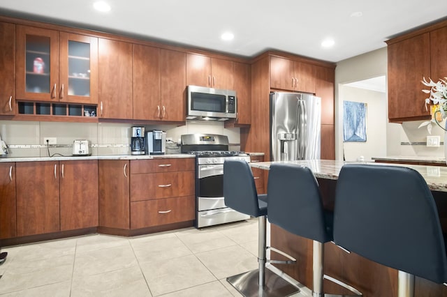 3104 Antelope Springs Rd, Northbrook, IL 60062 - kitchen with light stone countertops, glass insert cabinets, appliances with stainless steel finishes, and recessed lighting