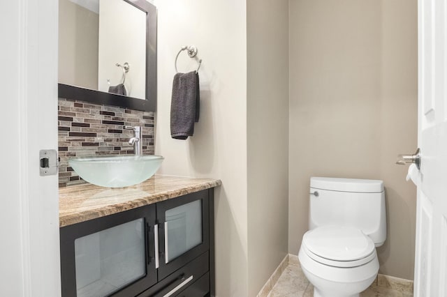 3104 Antelope Springs Rd, Northbrook, IL 60062 - bathroom with baseboards, tasteful backsplash, toilet, and vanity