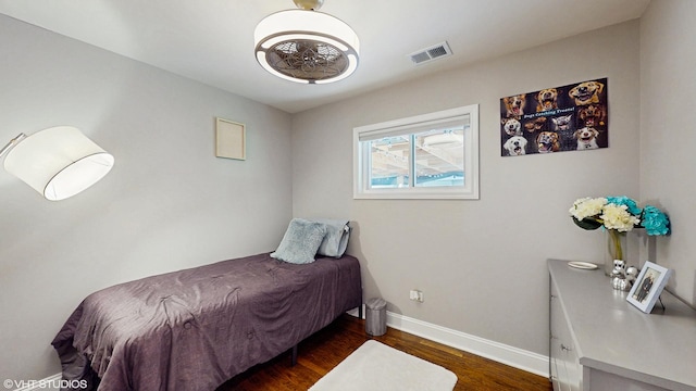 5743 Sherman Ave, Downers Grove, IL 60516 - bedroom with visible vents, baseboards, and wood finished floors