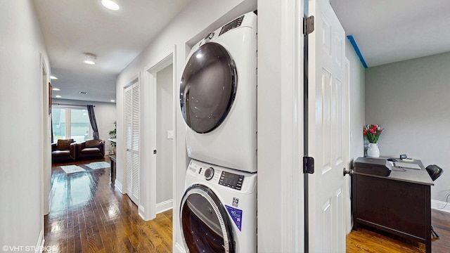 5743 Sherman Ave, Downers Grove, IL 60516 - laundry area featuring baseboards, laundry area, stacked washer / dryer, and wood finished floors