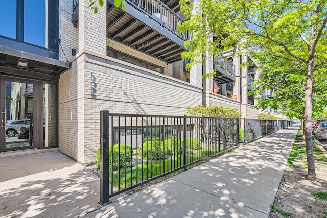 1350 W Walton St Unit 1W, Chicago, IL 60642 - view of side of home with brick siding