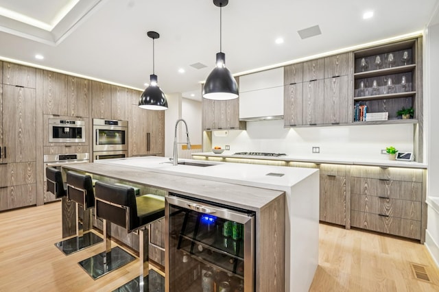 1350 W Walton St Unit 1W, Chicago, IL 60642 - kitchen with a sink, wine cooler, modern cabinets, light wood-type flooring, and recessed lighting