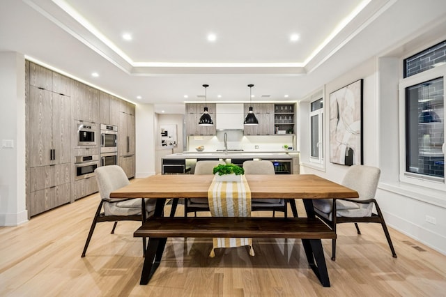 1350 W Walton St Unit 1W, Chicago, IL 60642 - dining space with a tray ceiling, recessed lighting, light wood-style flooring, and baseboards