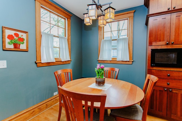 605 Ashland Ave, River Forest, IL 60305 - dining area featuring baseboards, a chandelier, and light wood finished floors