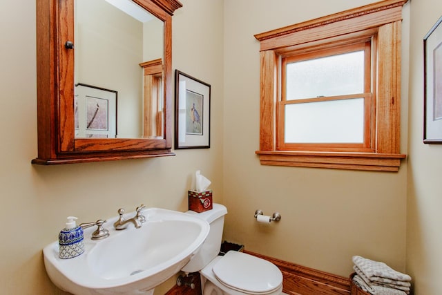 605 Ashland Ave, River Forest, IL 60305 - bathroom with toilet, a sink, and baseboards
