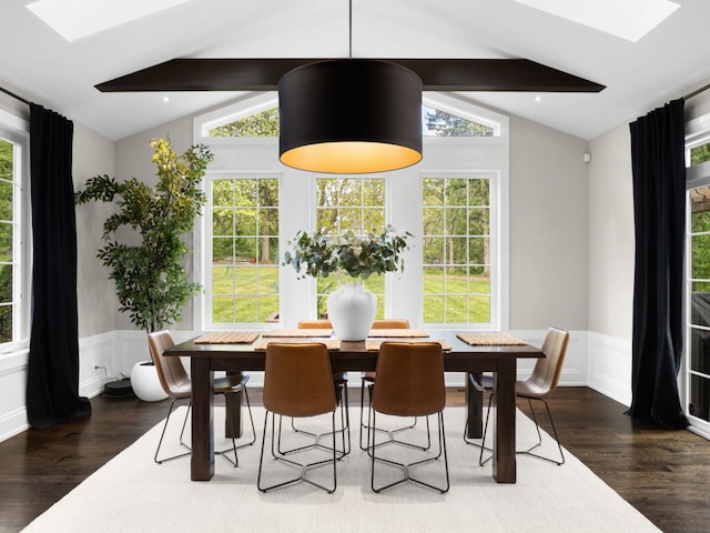 301 Canterbury Ln, Inverness, IL 60010 - dining space featuring a skylight, dark wood-type flooring, a wainscoted wall, and a decorative wall