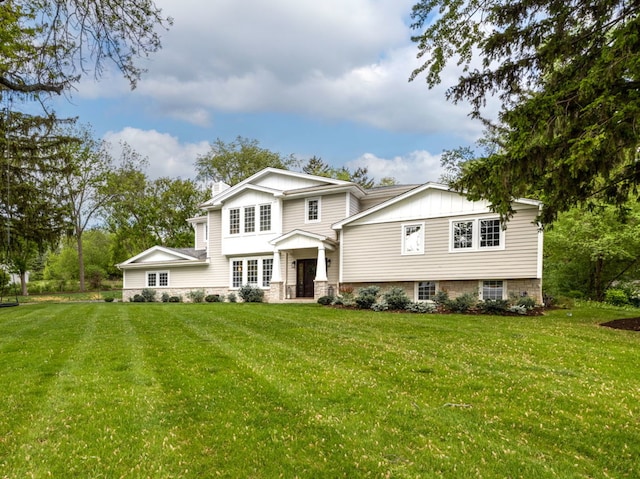 301 Canterbury Ln, Inverness, IL 60010 - view of front of property with board and batten siding and a front lawn