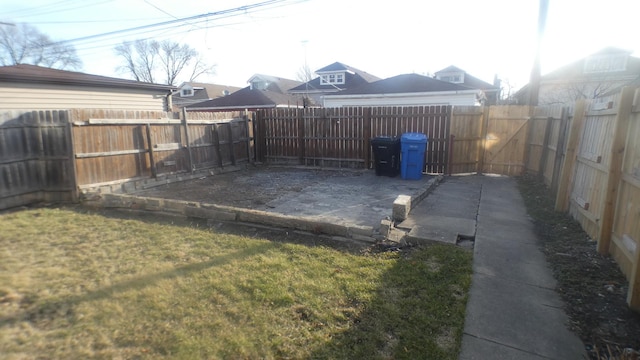 view of yard with a fenced backyard and a patio