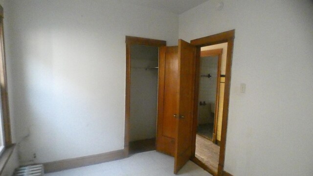 unfurnished bedroom featuring a closet