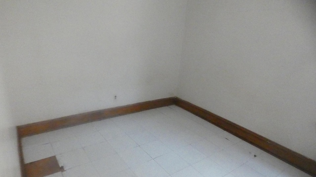unfurnished room with light floors