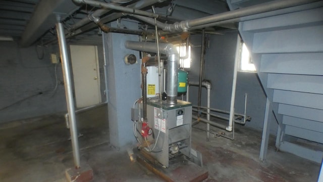 unfinished below grade area with a heating unit