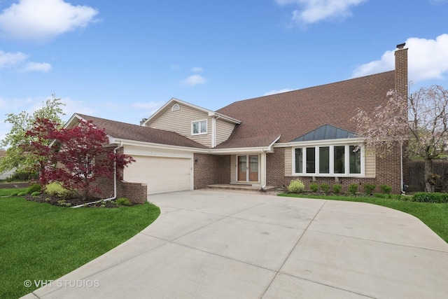 view of front of house with a chimney, a garage, brick siding, a front lawn, and concrete driveway